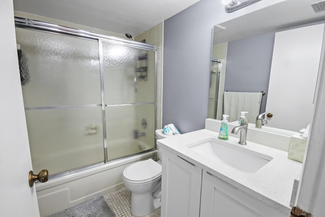 full bathroom featuring vanity, toilet, and combined bath / shower with glass door