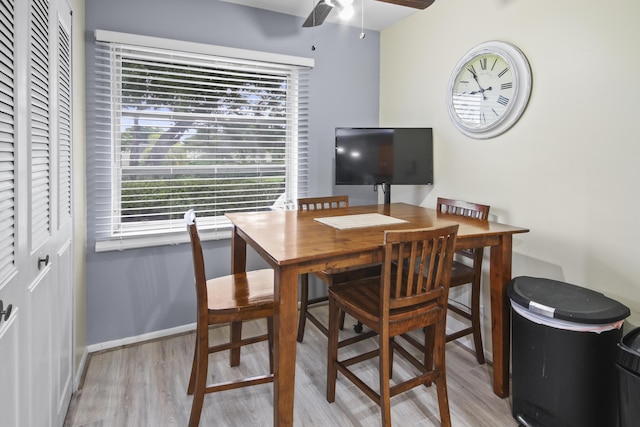 home office with ceiling fan and light hardwood / wood-style flooring