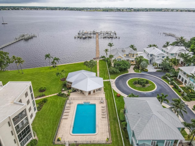 birds eye view of property with a water view