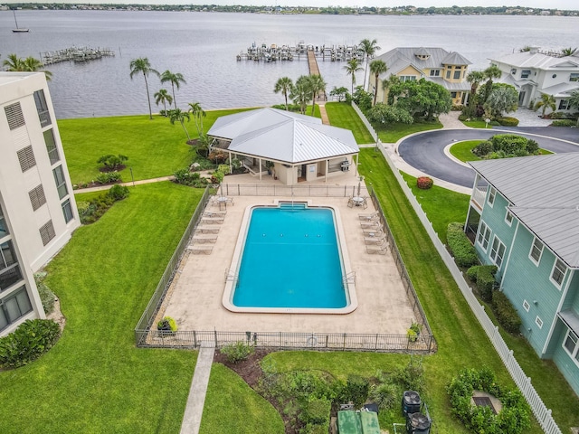 view of swimming pool with a water view