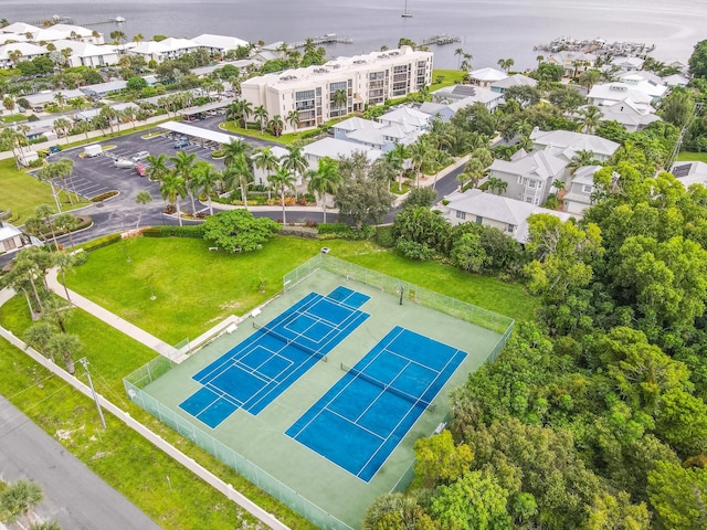 birds eye view of property with a water view