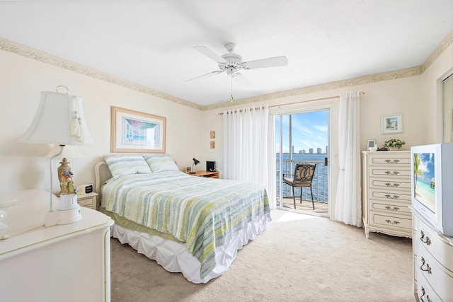 bedroom with ceiling fan, light colored carpet, and access to outside