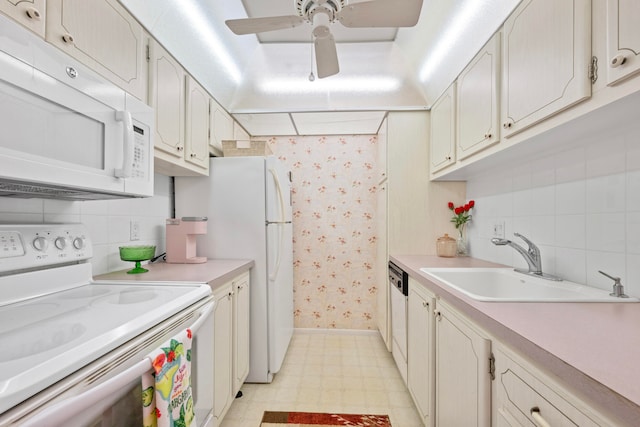 kitchen featuring ceiling fan, sink, white appliances, and decorative backsplash