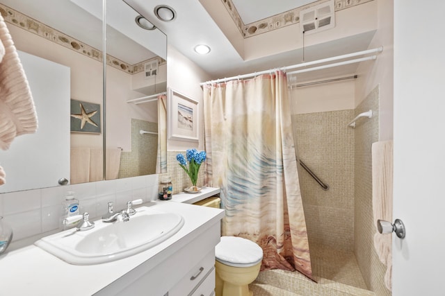 bathroom with backsplash, vanity, toilet, and a shower with shower curtain