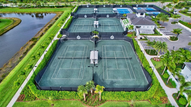 birds eye view of property with a water view