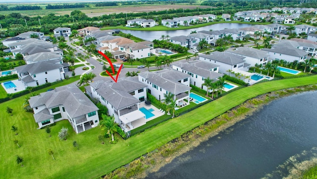 bird's eye view with a water view