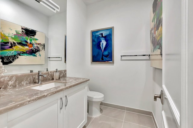 bathroom with tile patterned floors, vanity, and toilet