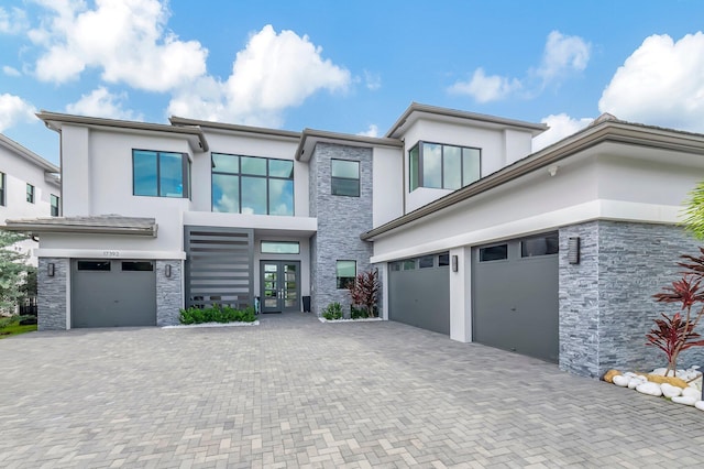 view of front facade with french doors and a garage