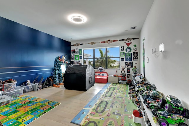 playroom with wood-type flooring