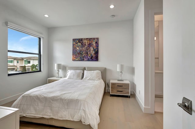 bedroom with light hardwood / wood-style flooring