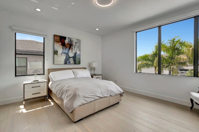 bedroom with light hardwood / wood-style floors