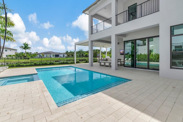 view of pool featuring a patio area