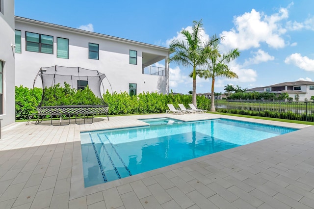 view of pool featuring a patio