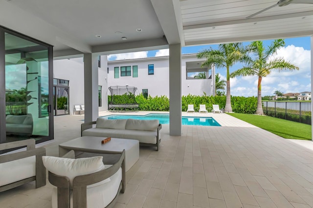 view of patio / terrace featuring outdoor lounge area and a fenced in pool