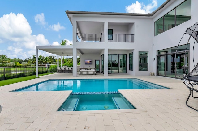 view of pool with a patio area, an in ground hot tub, and outdoor lounge area