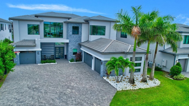 view of front of property with cooling unit and a front yard