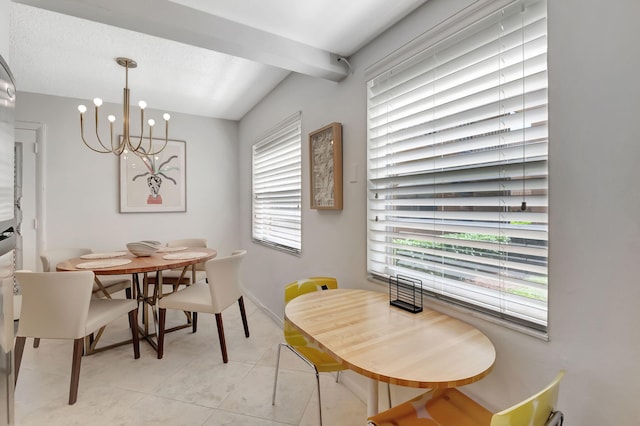 436 Flanders J, Delray Beach, FL 33484 - dining space featuring plenty of natural light, a chandelier, beamed ceiling, light tile patterned flooring, and baseboards