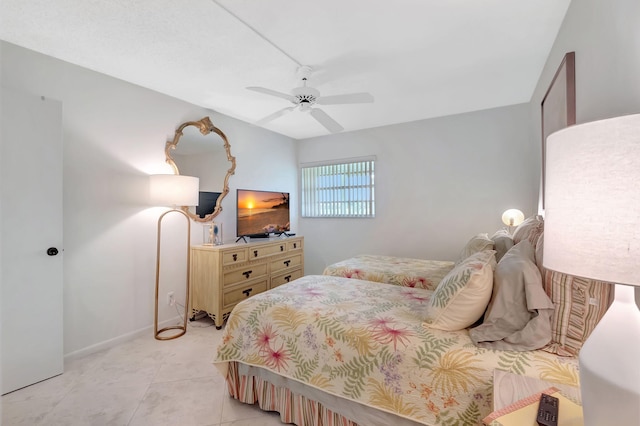 tiled bedroom with ceiling fan