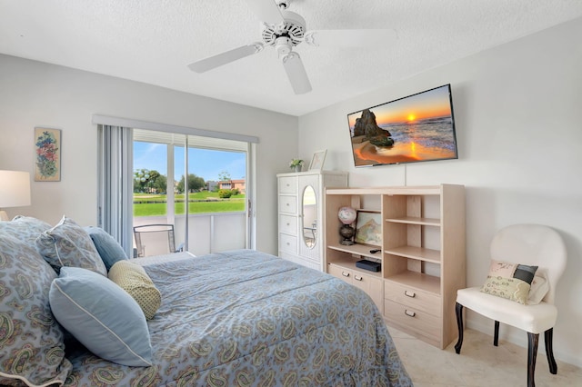 bedroom featuring ceiling fan, a textured ceiling, and light tile patterned floors