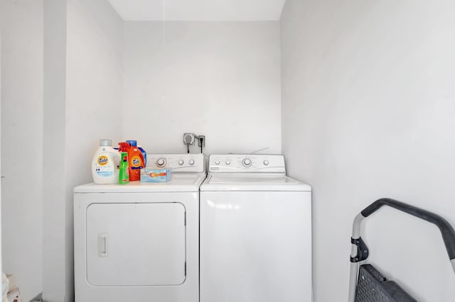 laundry room featuring washing machine and clothes dryer