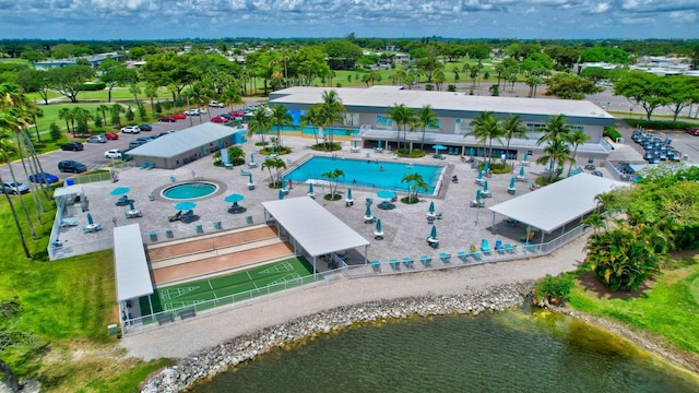 birds eye view of property with a water view