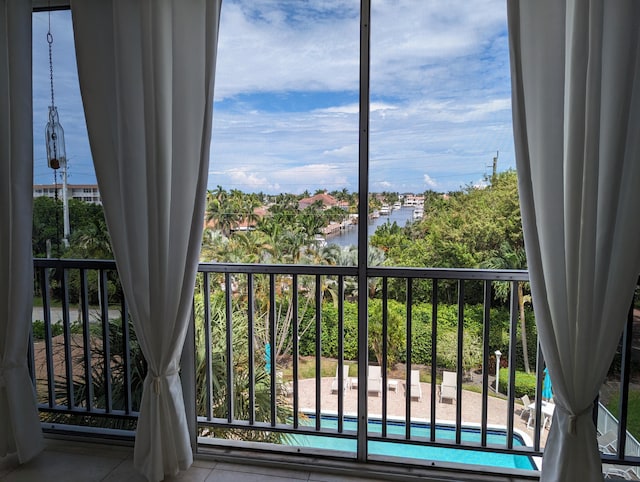 balcony featuring a water view