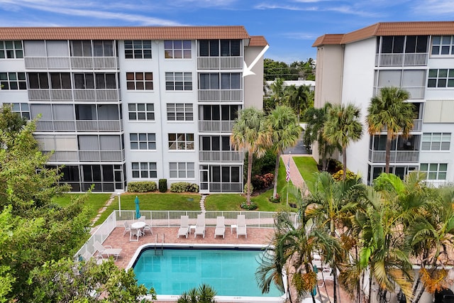 view of swimming pool with a lawn and a patio area