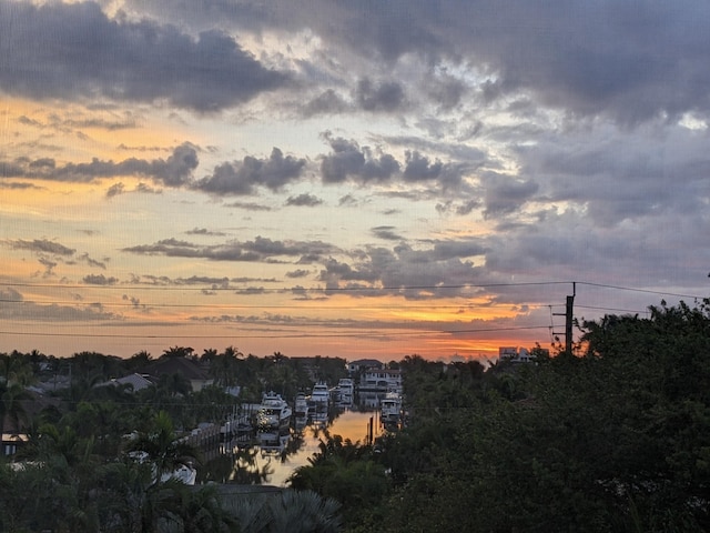 nature at dusk featuring a water view