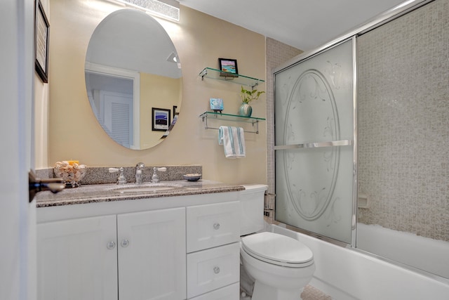 full bathroom with vanity, toilet, and enclosed tub / shower combo