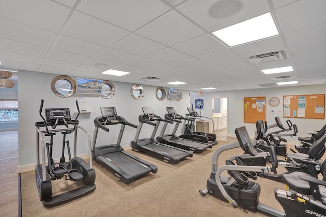 workout area with a paneled ceiling