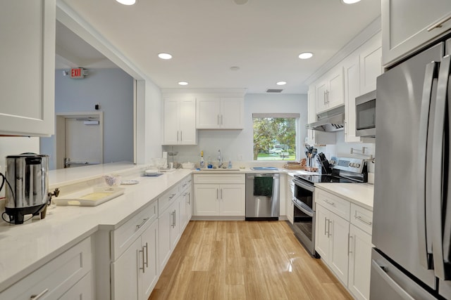 kitchen featuring white cabinets, sink, and appliances with stainless steel finishes