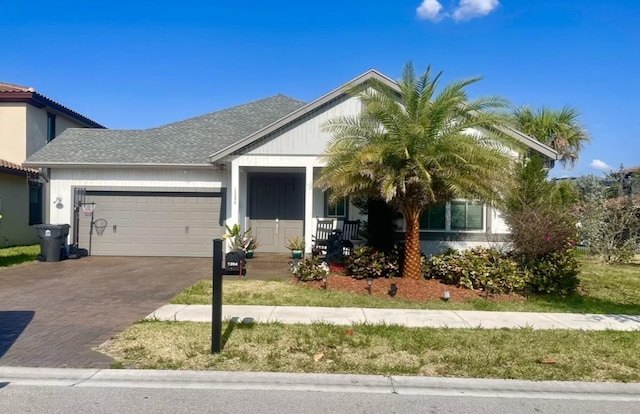 view of front of house with a porch and a garage