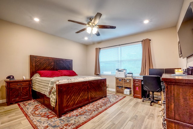 bedroom with ceiling fan and light hardwood / wood-style flooring