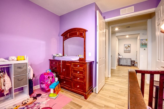 bedroom with light hardwood / wood-style flooring