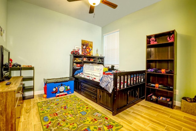 bedroom with light wood-type flooring and ceiling fan