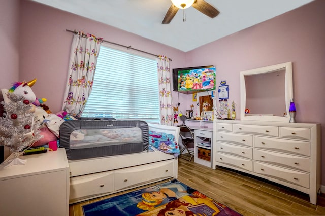 bedroom featuring wood-type flooring and ceiling fan