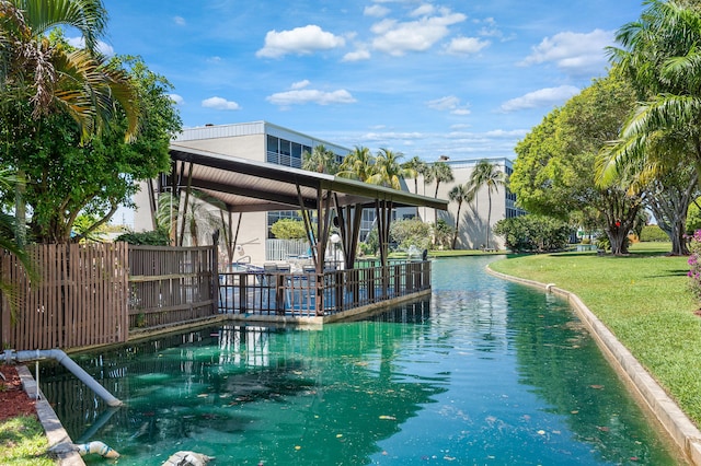 view of pool with a lawn