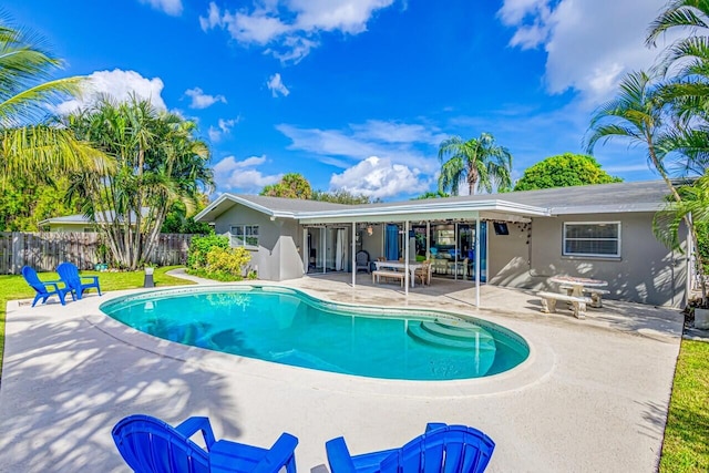 view of swimming pool featuring a patio area