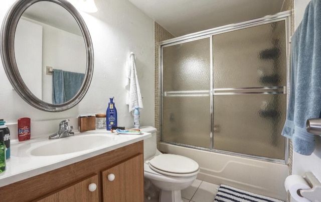 full bathroom with tile patterned flooring, vanity, toilet, and enclosed tub / shower combo