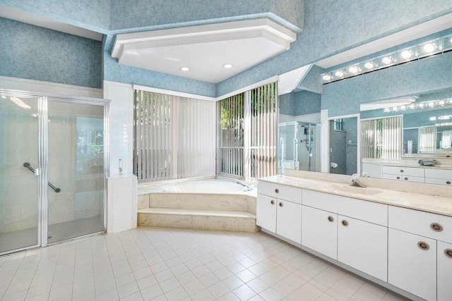 bathroom with vanity, shower with separate bathtub, and tile patterned floors