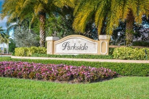 community / neighborhood sign featuring a yard