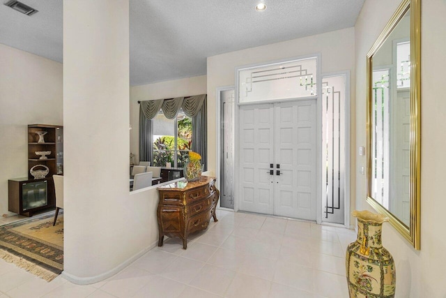 entrance foyer featuring a textured ceiling