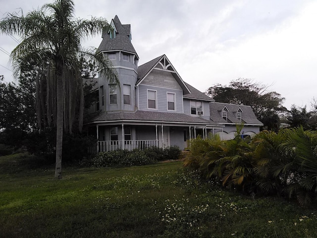 view of front of house with a front lawn and a porch