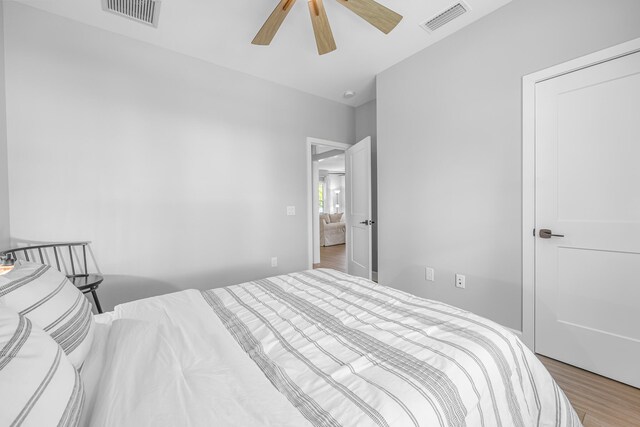 bedroom featuring ceiling fan and hardwood / wood-style floors