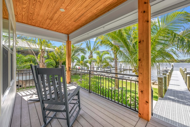 wooden deck featuring a water view