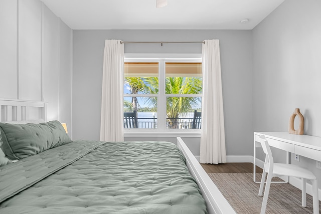 bedroom with hardwood / wood-style flooring