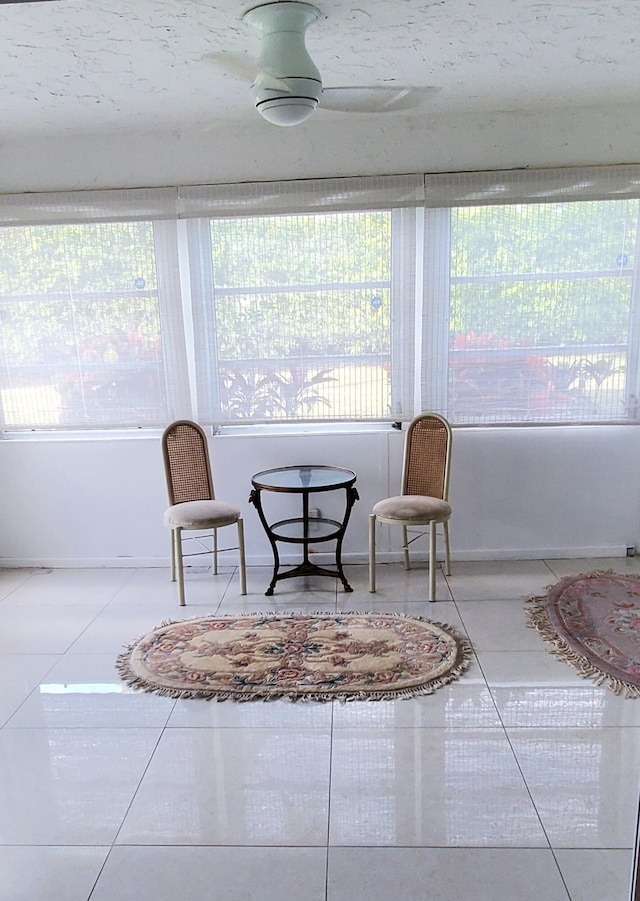 living area featuring tile patterned flooring and a wealth of natural light