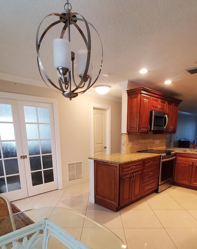 kitchen with tasteful backsplash, light tile patterned floors, stainless steel appliances, an inviting chandelier, and french doors