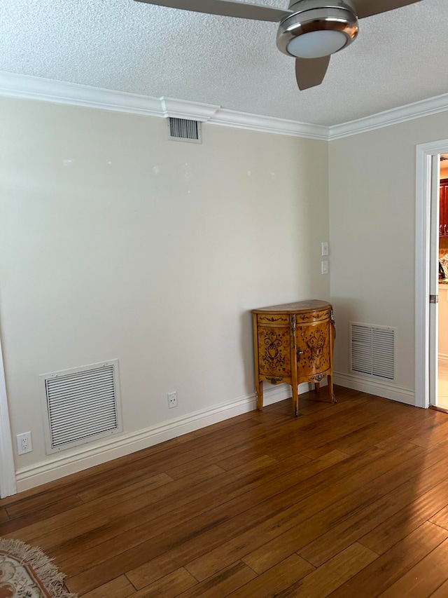 unfurnished room with a textured ceiling, ornamental molding, hardwood / wood-style floors, and ceiling fan