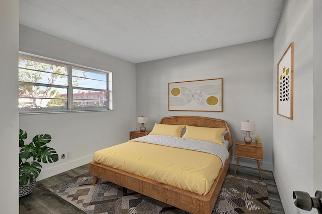 bedroom featuring dark wood-type flooring